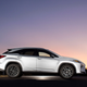 A photo of a Lexus RX SUV at sunset.